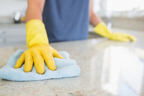 Cleaner wearing PPE during a carpet cleaning job